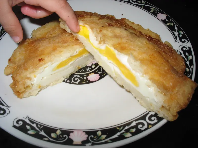 Arepa de huevo, deep-fried and stuffed with egg
